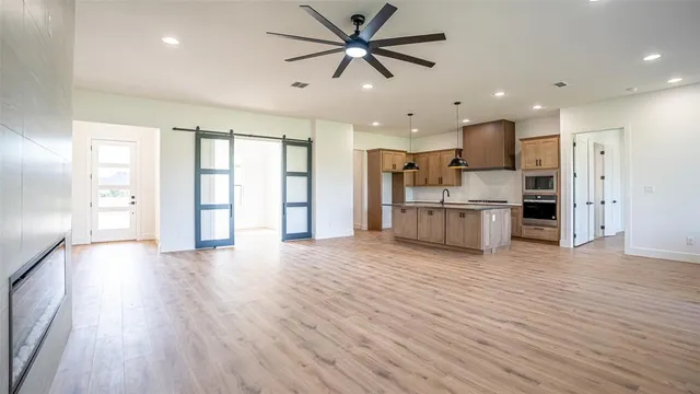a view of a kitchen with a stove cabinets and wooden floor