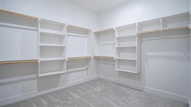 a view of an empty walk in closet