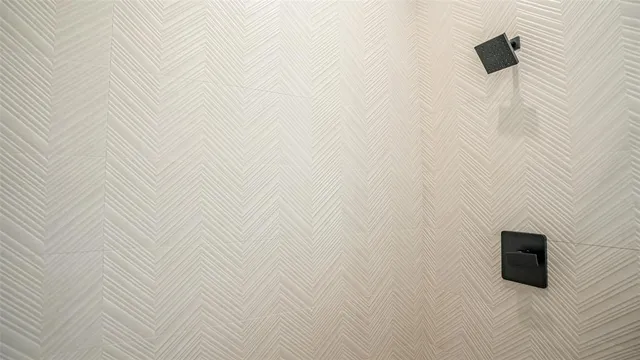 a bathroom with double vanity sink two mirror and a window