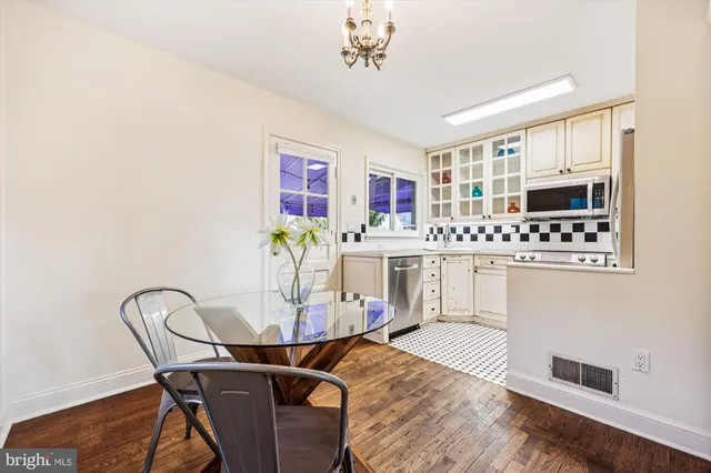 a kitchen with stainless steel appliances a stove sink and refrigerator