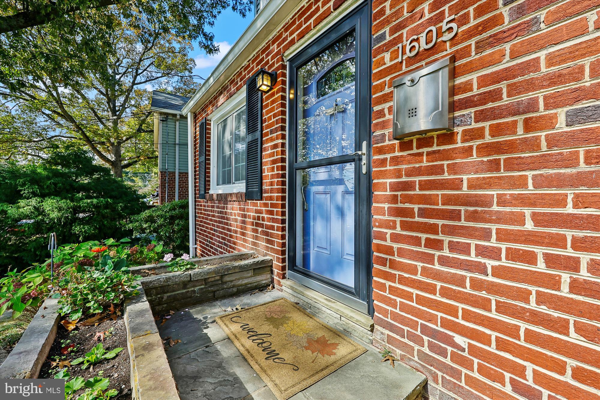1605 Windham Lane Silver Spring, MD 20902 - Photo 2 of 65 a view of a brick house with a yard