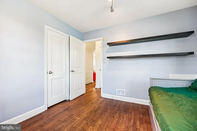 a view of a livingroom with furniture and gym equipment