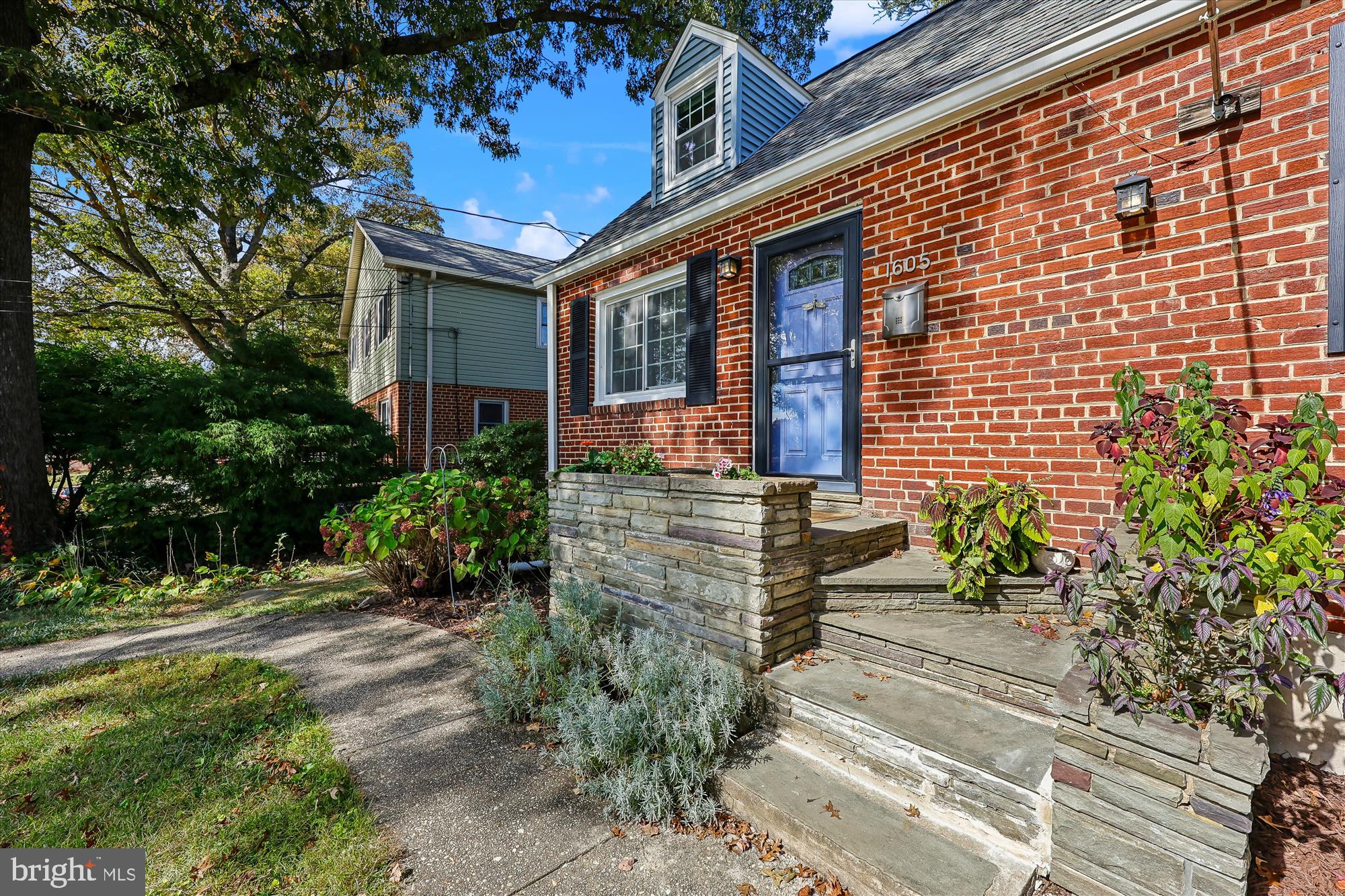 1605 Windham Lane Silver Spring, MD 20902 - Photo 34 of 65 a front view of a house with a yard