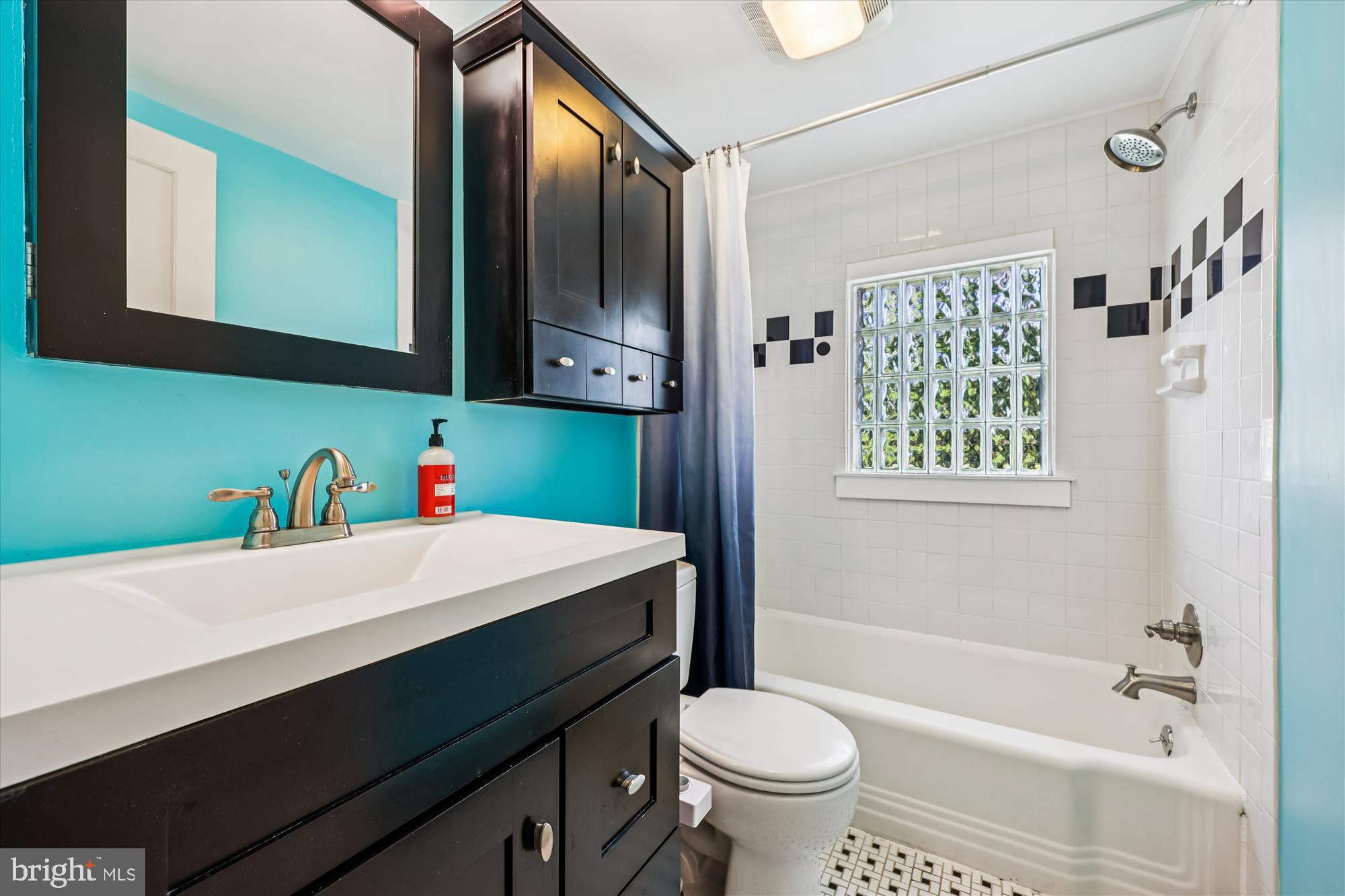 1605 Windham Lane Silver Spring, MD 20902 - Photo 41 of 65 a bathroom with a sink a toilet and a bathtub