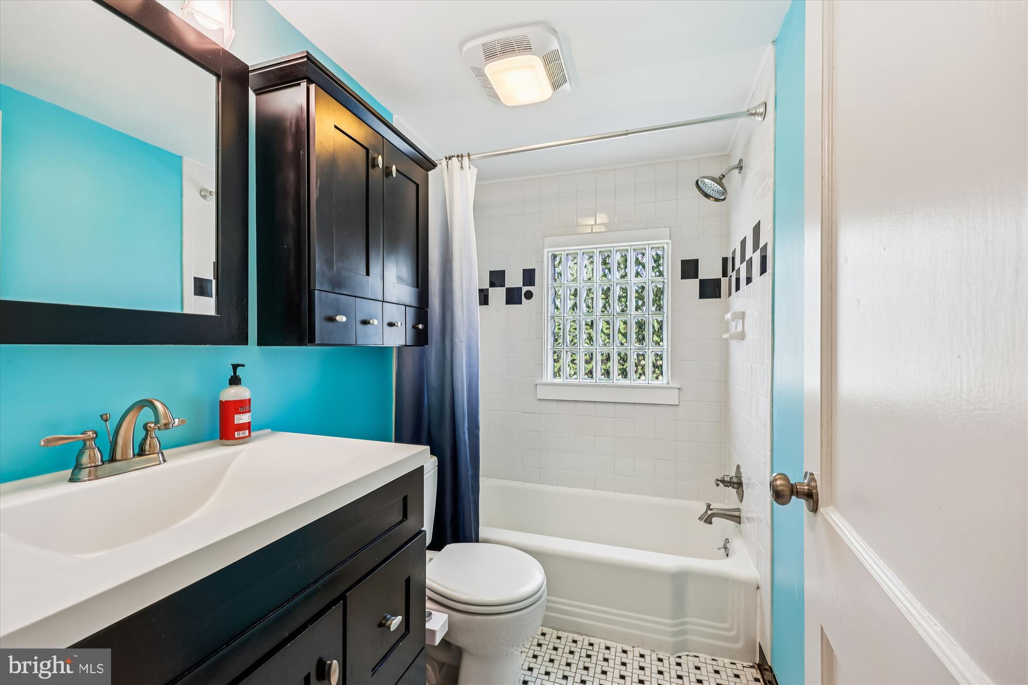 1605 Windham Lane Silver Spring, MD 20902 - Photo 42 of 65 a bathroom with a sink toilet vanity and shower