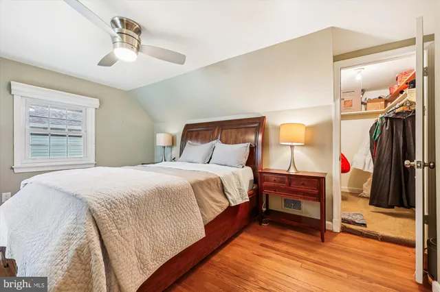 a picture of a bench in front of a white house