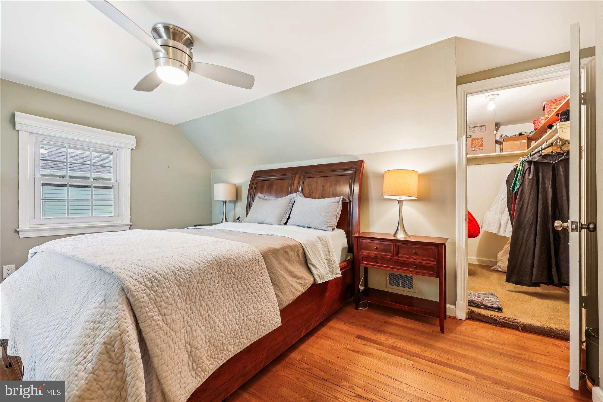 1605 Windham Lane Silver Spring, MD 20902 - Photo 47 of 65 a bedroom with a bed and a chandelier