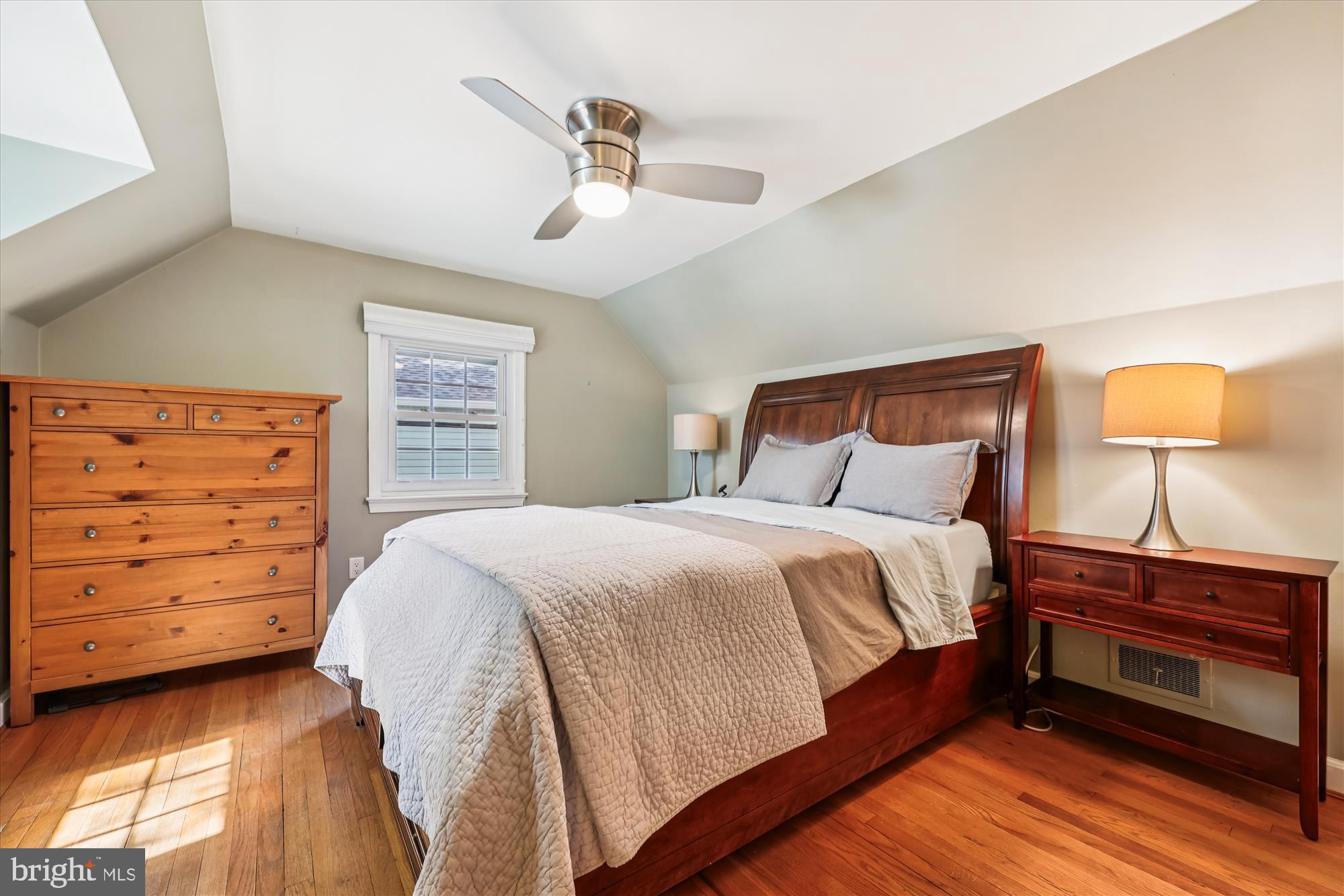 1605 Windham Lane Silver Spring, MD 20902 - Photo 48 of 65 a bedroom with a bed and a dresser