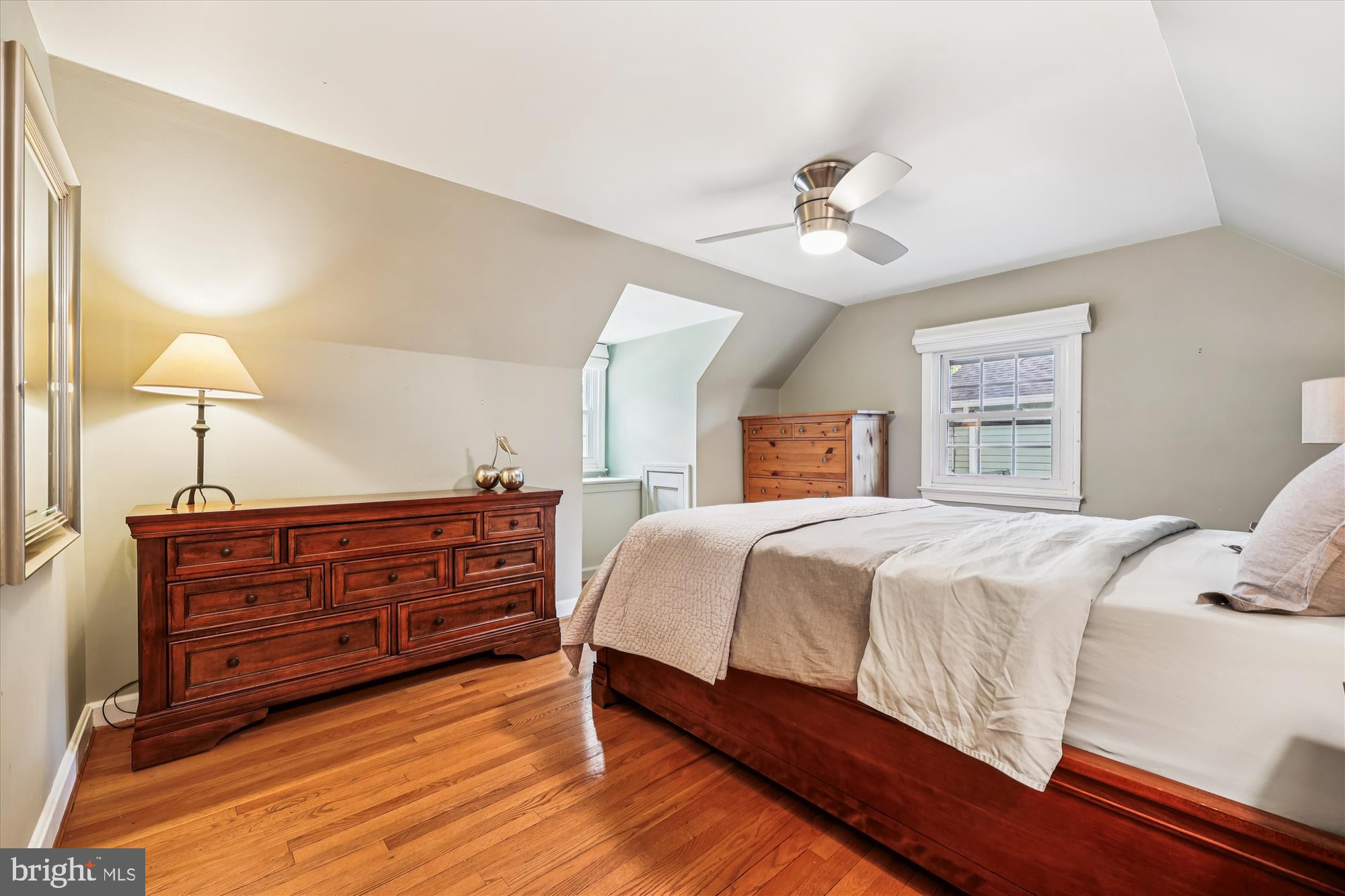 1605 Windham Lane Silver Spring, MD 20902 - Photo 49 of 65 a bedroom with a large bed and a chandelier