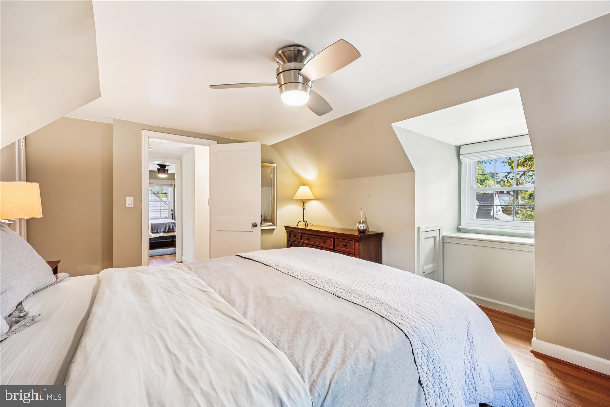 1605 Windham Lane Silver Spring, MD 20902 - Photo 50 of 65 a bedroom with a large bed and a chandelier