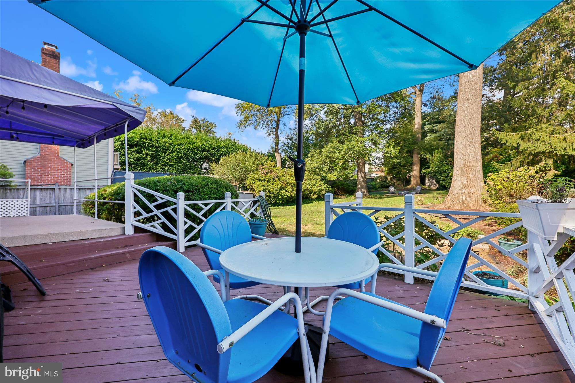 1605 Windham Lane Silver Spring, MD 20902 - Photo 57 of 65 a view of an outdoor sitting area with furniture and umbrella
