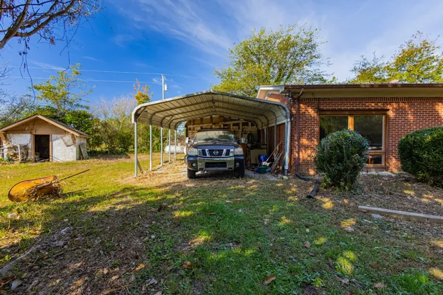 a view of a workspace with furniture and wooden floor