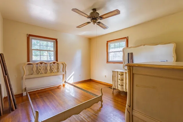 a kitchen with granite countertop a sink cabinets stainless steel appliances and a counter space