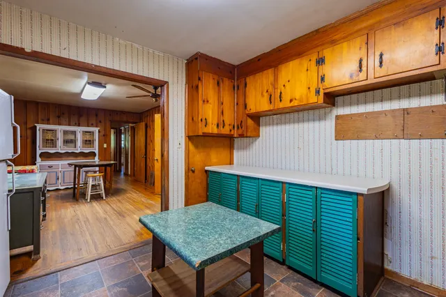 a view of a lake with houses in the back