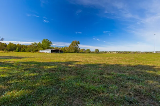 a view of house with outdoor space and entertaining space