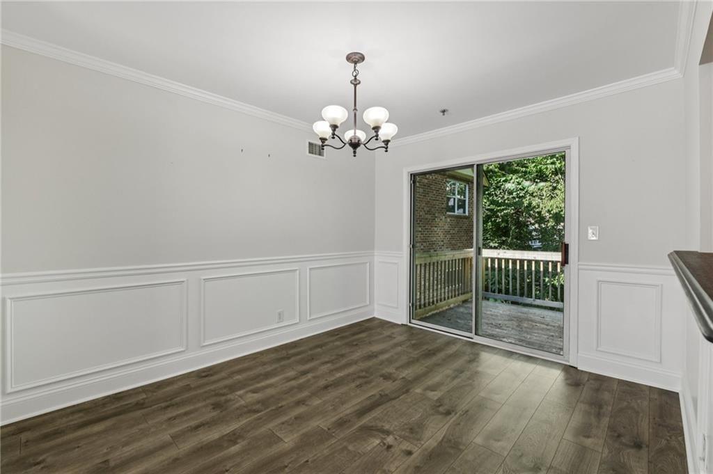 2825 Northeast Expressway, Unit F3 Atlanta, GA 30345 - Photo 11 of 45 a view of a room with wooden floor staircase and windows