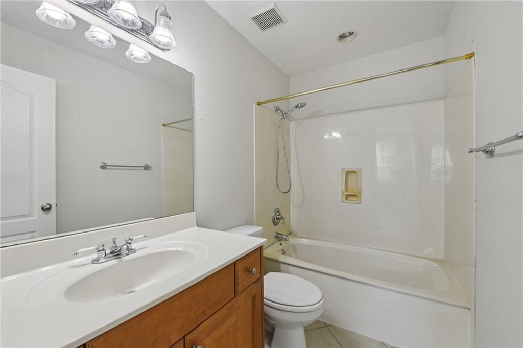 2825 Northeast Expressway, Unit F3 Atlanta, GA 30345 - Photo 28 of 45 a bathroom with a sink a toilet and shower
