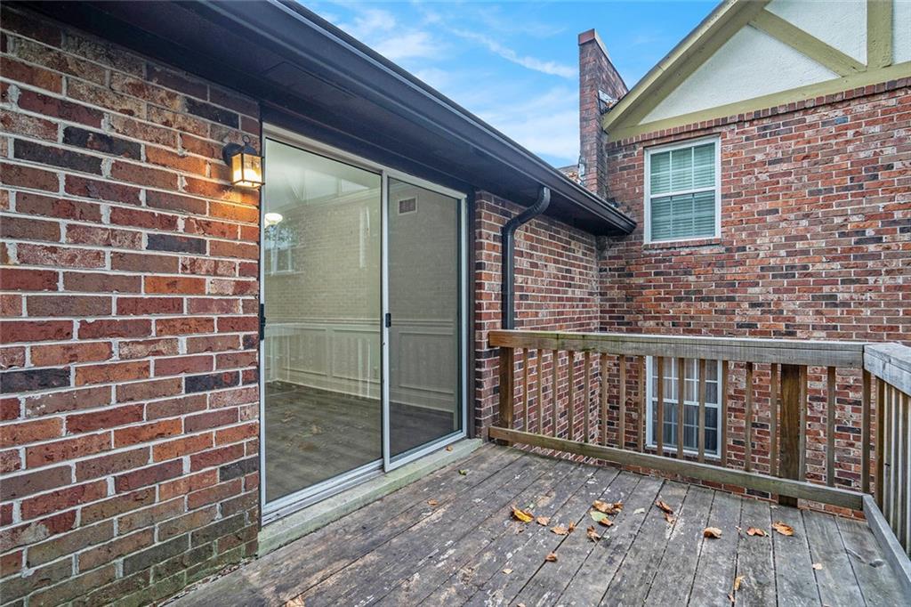 2825 Northeast Expressway, Unit F3 Atlanta, GA 30345 - Photo 39 of 45 a view of a brick house with a balcony