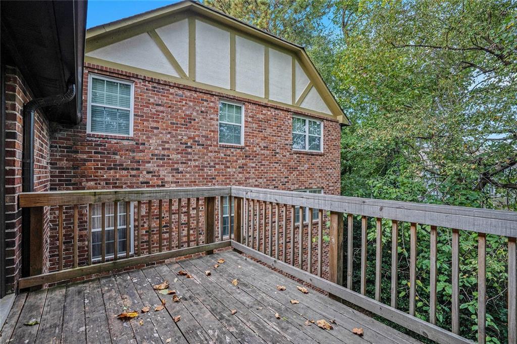 2825 Northeast Expressway, Unit F3 Atlanta, GA 30345 - Photo 41 of 45 a view of a brick house with wooden fence