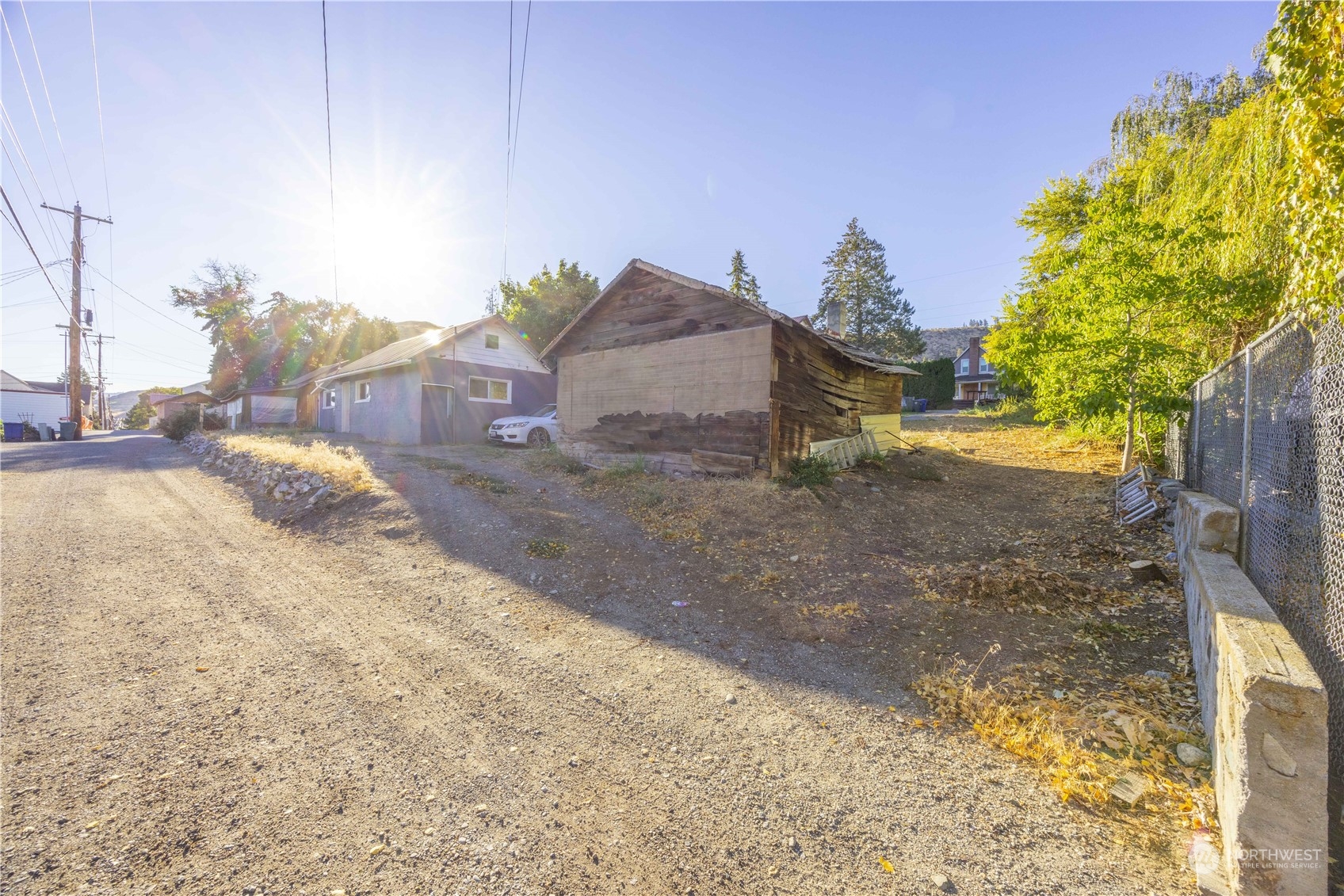 2216 West Prospect Street Chelan, WA 98816 - Photo 19 of 26 a view of a dry yard with wooden fence