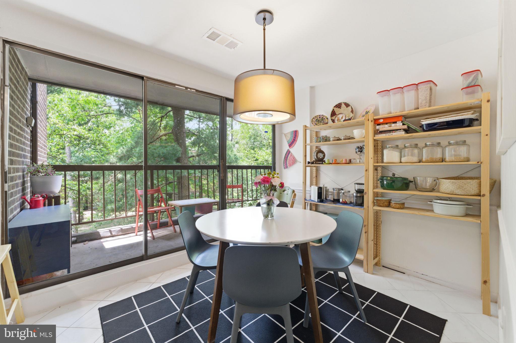 11260 Chestnut Grove Square, Unit 337 Reston, VA 20190 - Photo 25 of 82 Bright dining space with nature views.