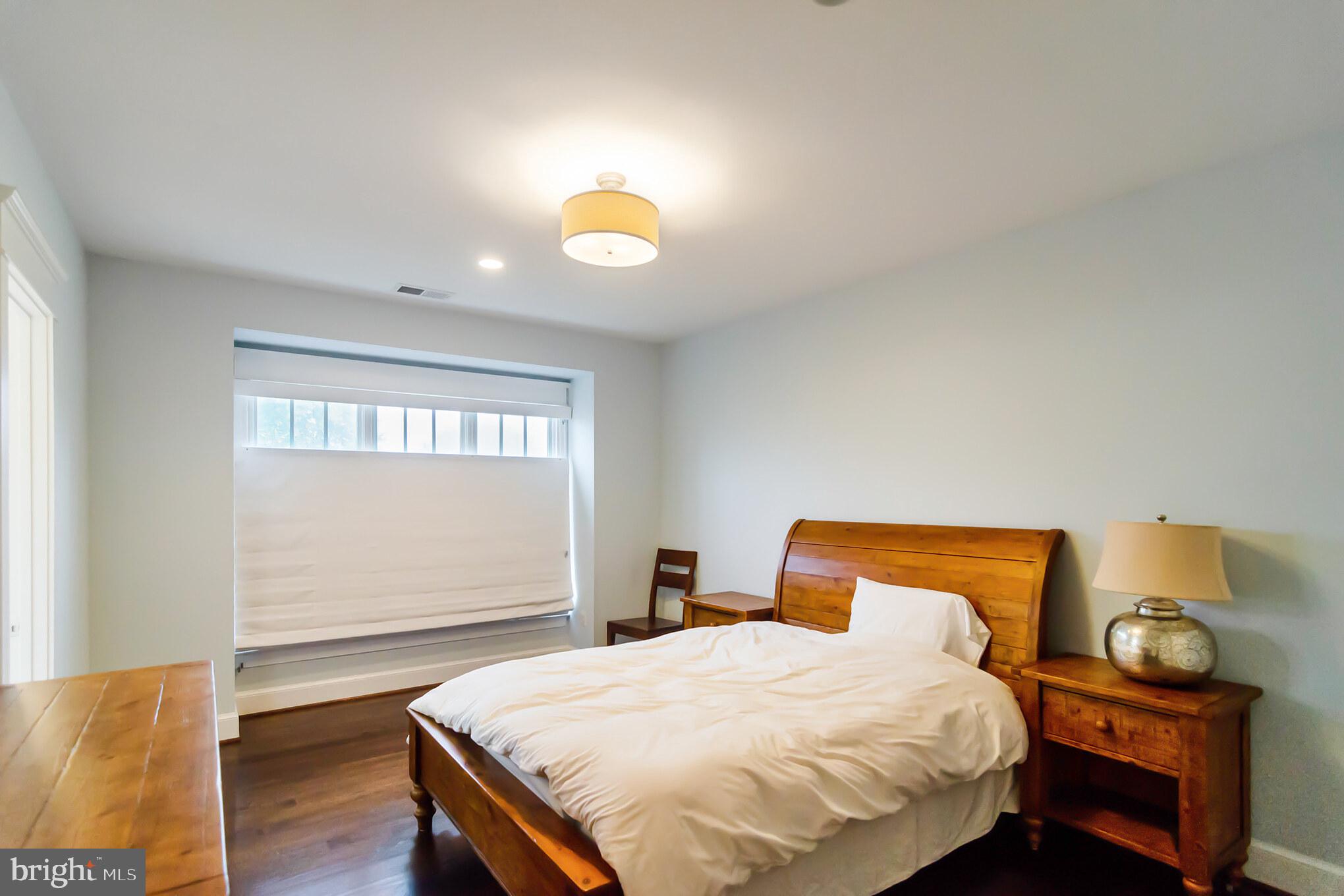 6801 Danforth Street McLean, VA 22101 - Photo 23 of 29 a bedroom with a bed and wooden floor