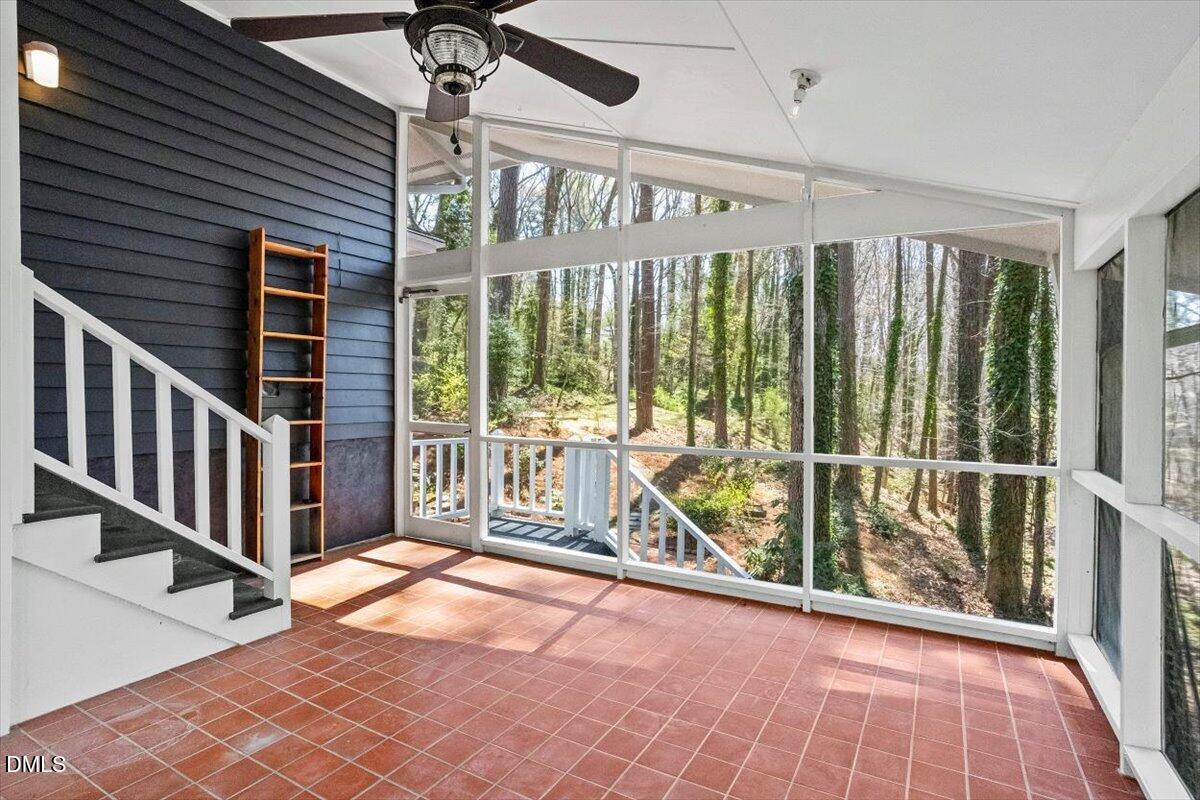 4805 Rembert Drive Raleigh, NC 27612 - Photo 4 of 45 a view of entryway with a floor to ceiling window and stairs