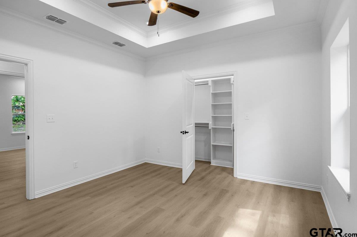 1610 West Barrett Street Tyler, TX 75702 - Photo 20 of 32 wooden floor in an empty room with a window