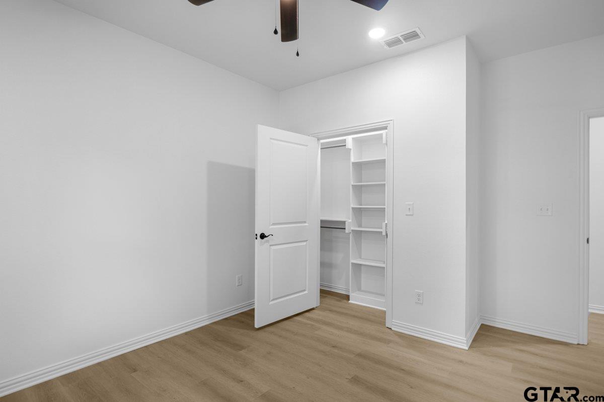 1610 West Barrett Street Tyler, TX 75702 - Photo 23 of 32 wooden floor in an empty room