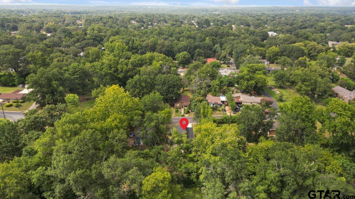 1610 West Barrett Street Tyler, TX 75702 - Photo 28 of 32 an aerial view of residential house with outdoor space and trees