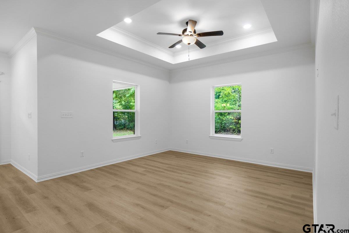 1610 West Barrett Street Tyler, TX 75702 - Photo 10 of 32 wooden floor in an empty room with a window