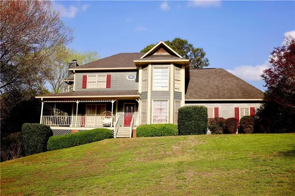 a front view of a house with a yard