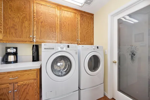 a bedroom with a bed and a dresser in it
