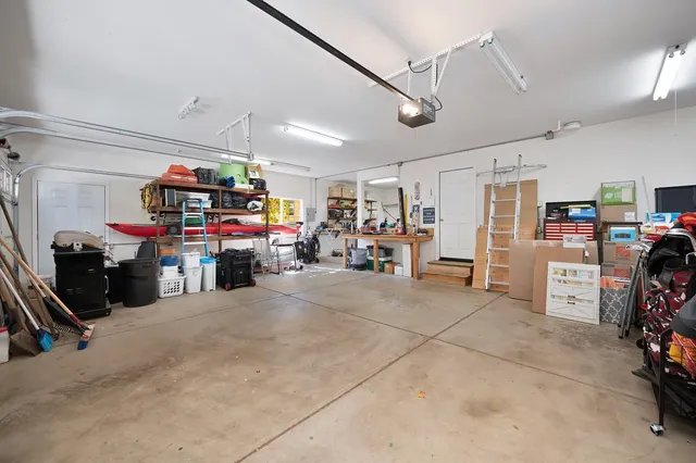a view of deck with table and chairs and wooden floor