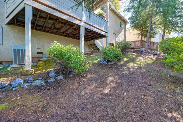an aerial view of a house with a yard and garden