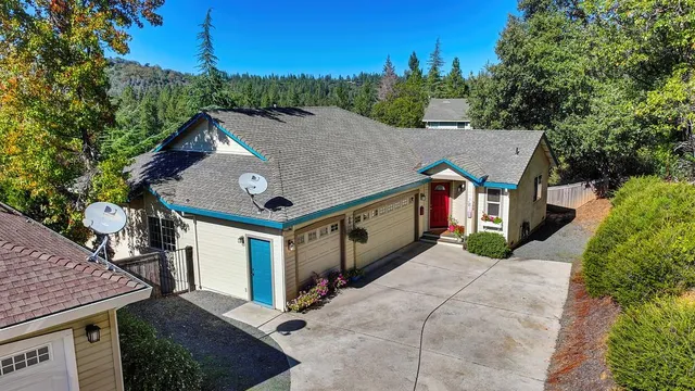 a living room with furniture a flat screen tv and a large window