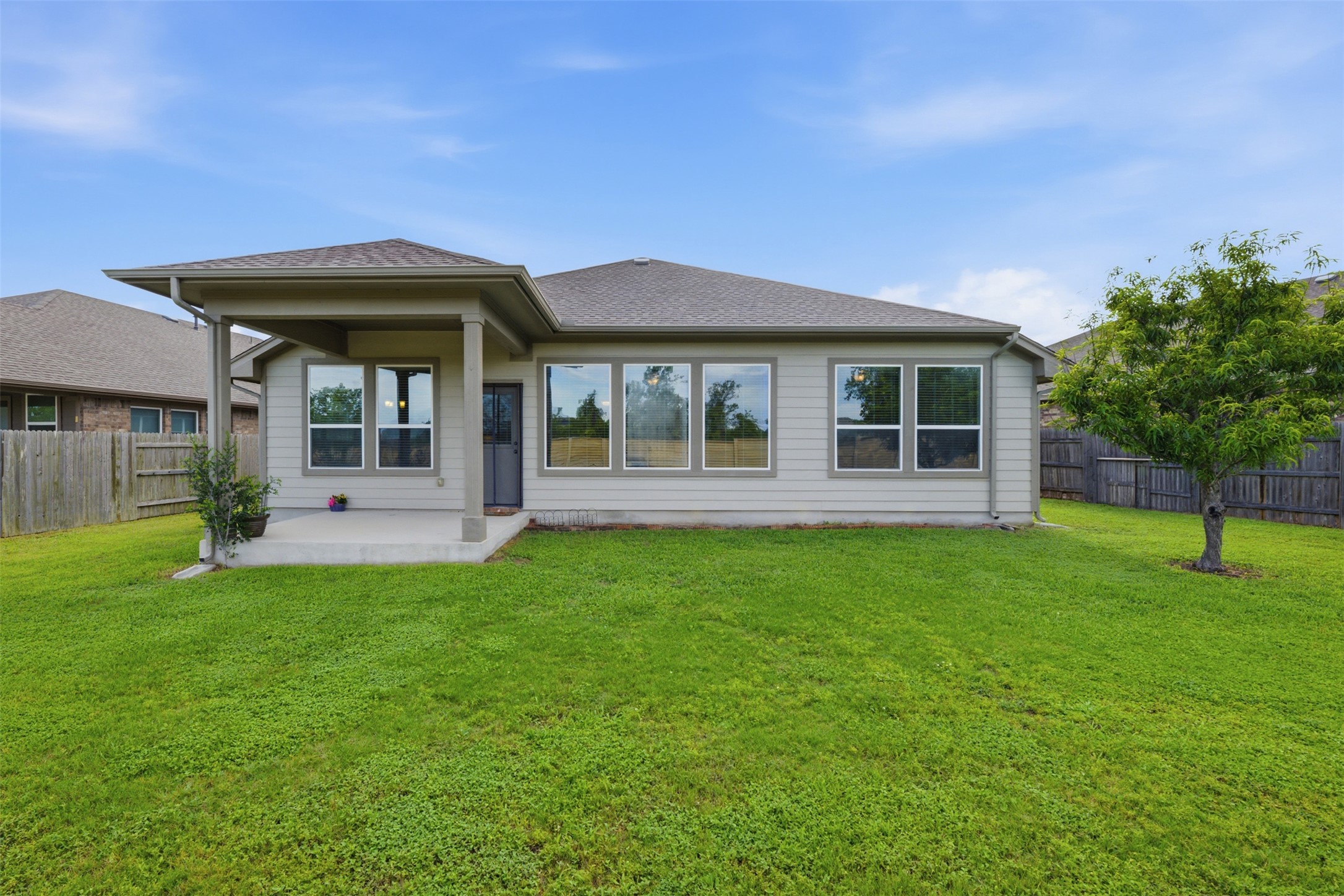 276 Gunnison Way Kyle, TX 78640 - Photo 20 of 28 a view of a house with a backyard