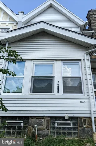 a front view of a house with garage