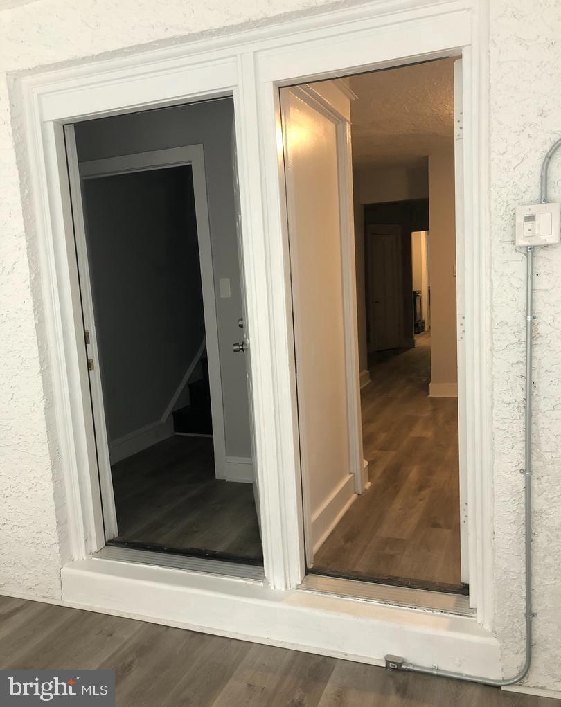 7265 Calvin Road Upper Darby, PA 19082 - Photo 2 of 12 a view of a hallway with wooden floor and entryway