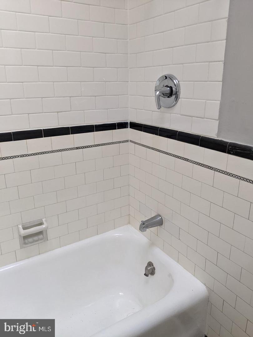 7265 Calvin Road Upper Darby, PA 19082 - Photo 6 of 12 a bathroom with a bathtub