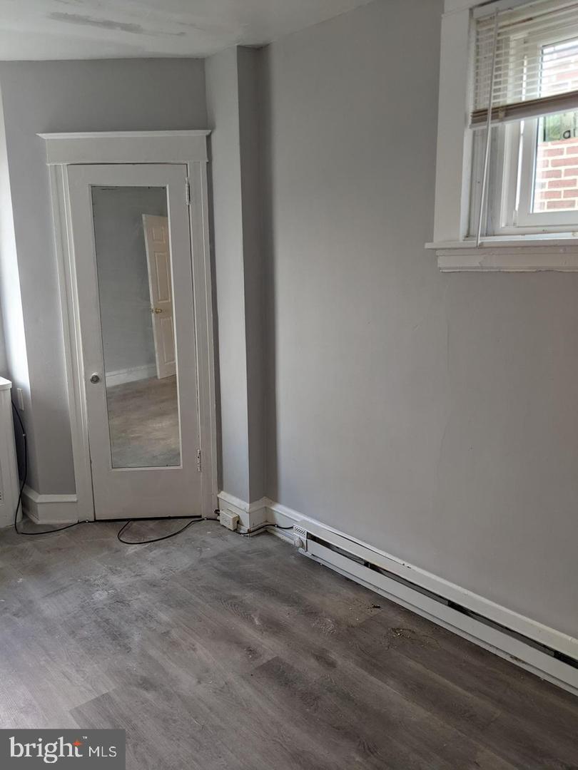 7265 Calvin Road Upper Darby, PA 19082 - Photo 8 of 12 a view of an empty room with a window