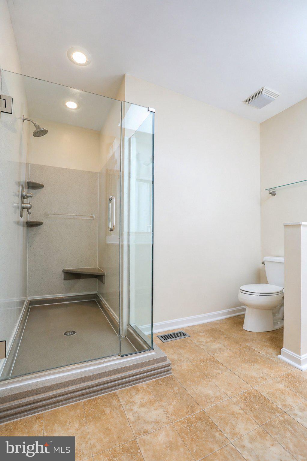 8021 Clark Station Road Severn, MD 21144 - Photo 18 of 35 Modern bathroom with sleek design.