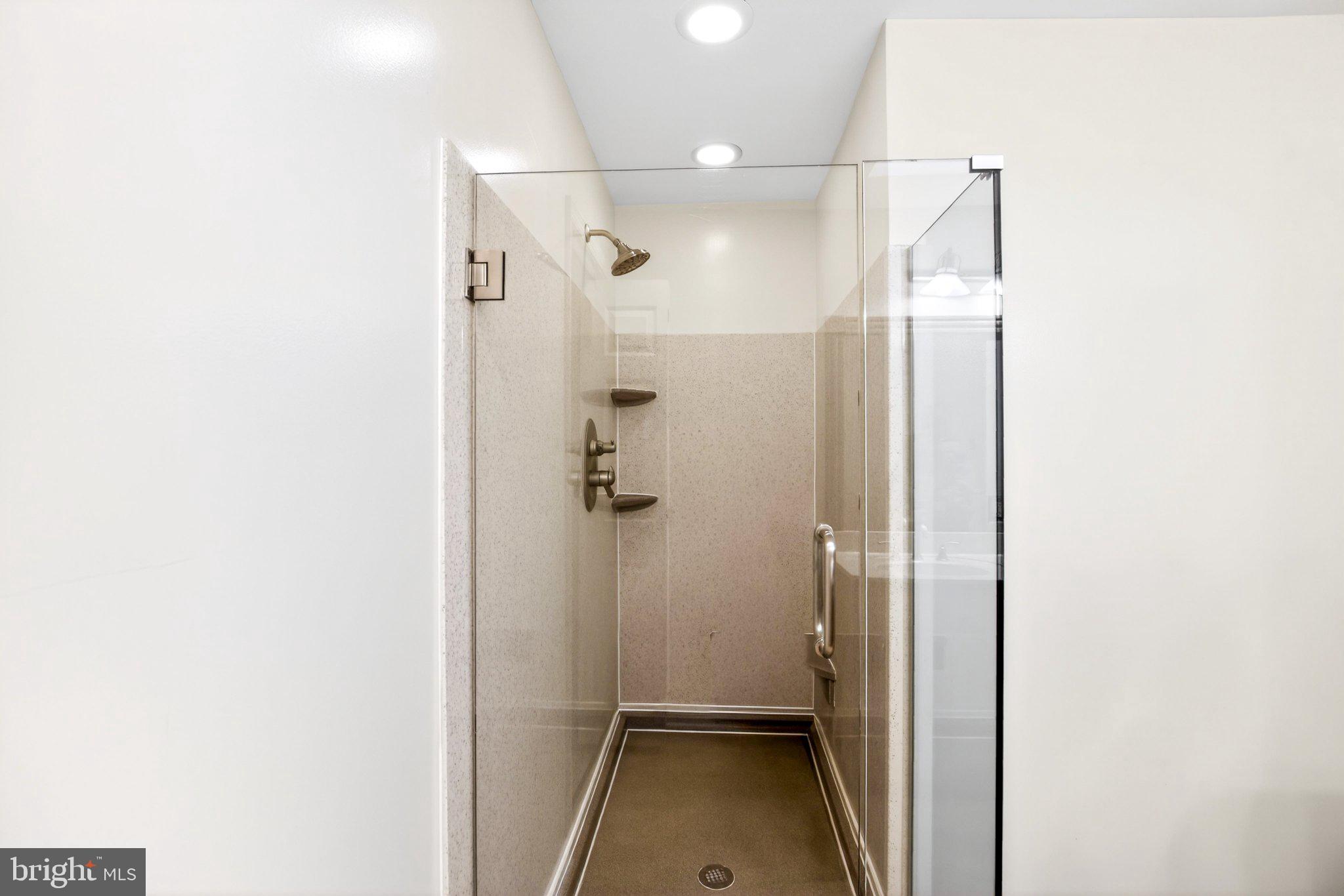 8021 Clark Station Road Severn, MD 21144 - Photo 19 of 35 Sleek, modern shower oasis.