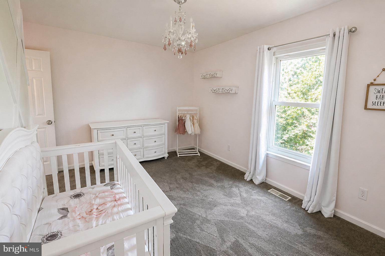 8021 Clark Station Road Severn, MD 21144 - Photo 21 of 35 Serene nursery with soft pastel hues.