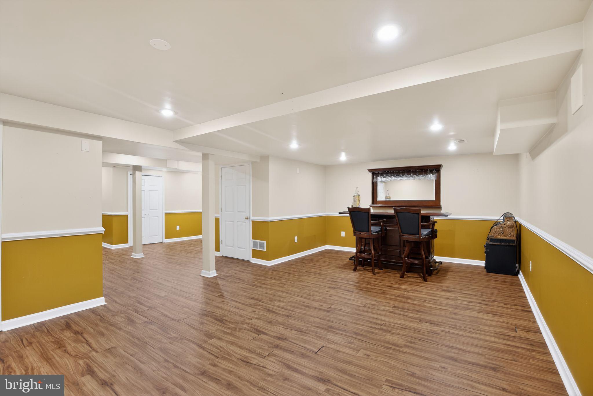 8021 Clark Station Road Severn, MD 21144 - Photo 25 of 35 Spacious basement with warm accents.