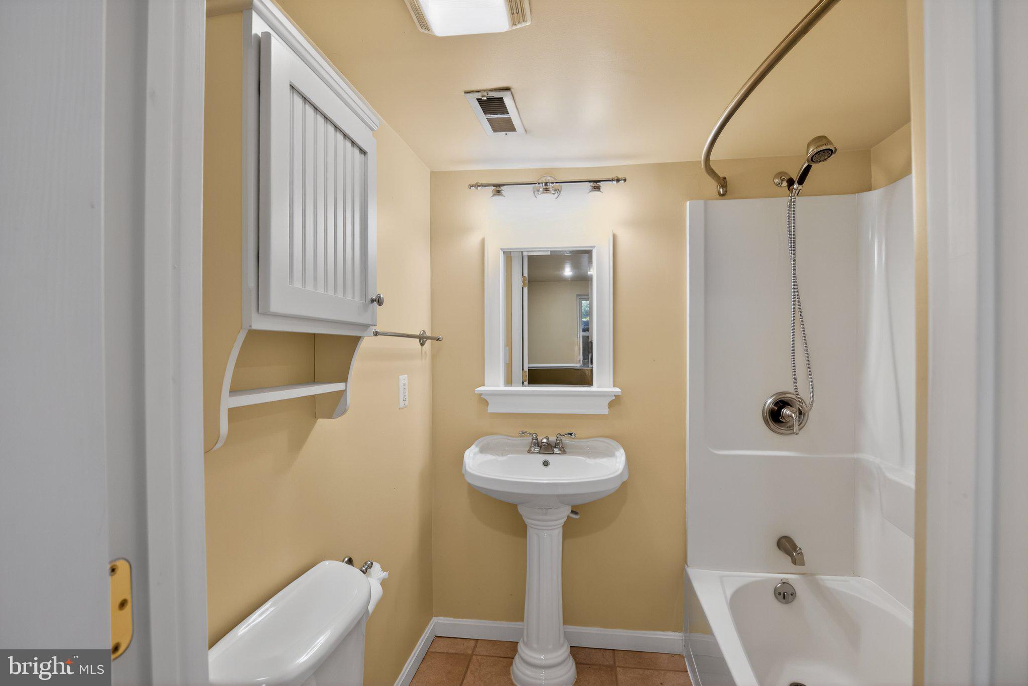 8021 Clark Station Road Severn, MD 21144 - Photo 28 of 35 Charming bathroom with modern touches.