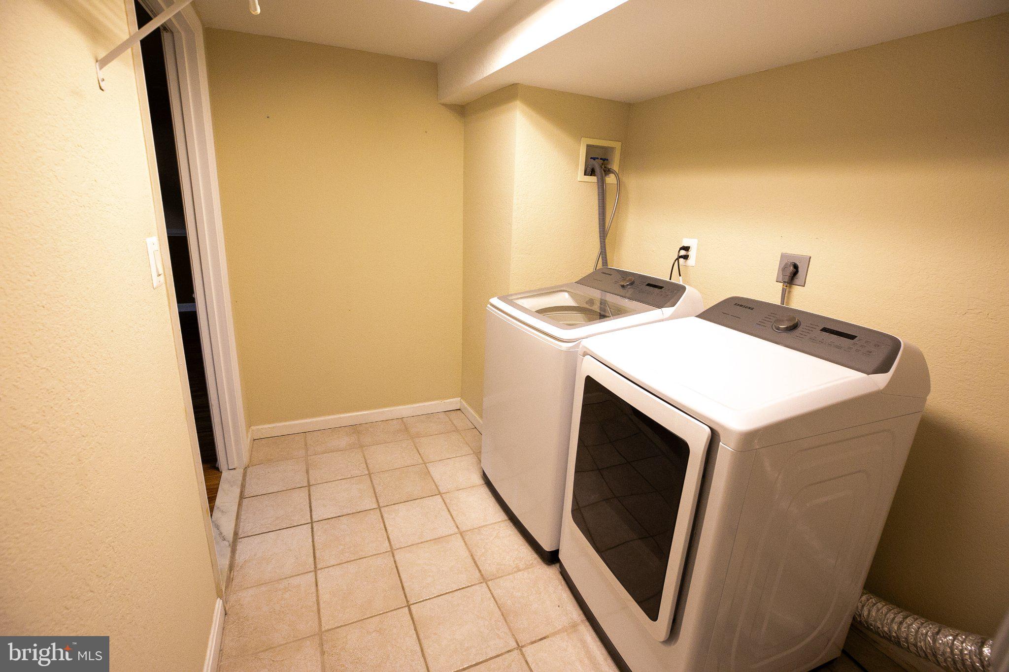 8021 Clark Station Road Severn, MD 21144 - Photo 29 of 35 Bright and functional laundry space.