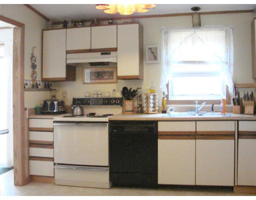 16 Folly Mill Road Salisbury, MA 01952 - Photo 5 of 10 a kitchen with cabinets appliances and a window