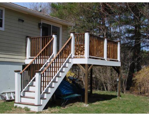 16 Folly Mill Road Salisbury, MA 01952 - Photo 8 of 10 a view of house with wooden stairs and small trees