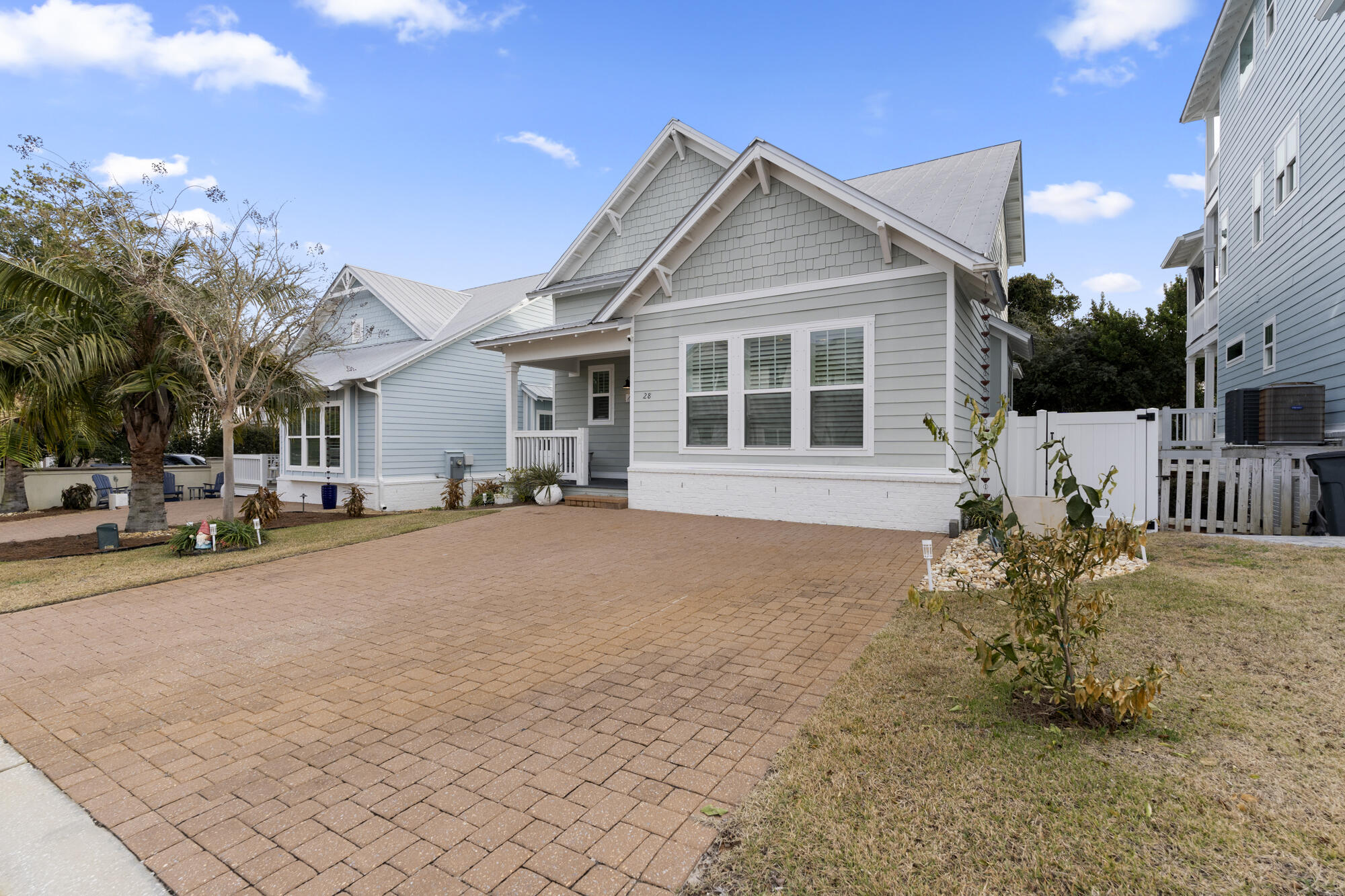 28 Inlet Cove Inlet Beach, FL 32461 - Photo 8 of 52 a front view of a house with a yard